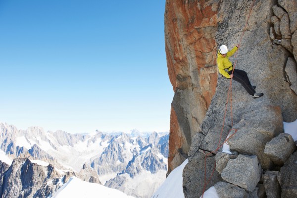 Mountaineer using climbing rope, Chamonix, Haute Savoie, France