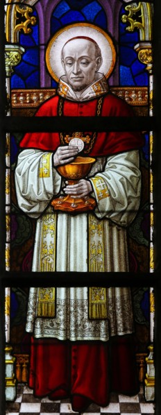 Stained Glass window in St Gummarus Church in Lier, Belgium, depicting a Cardinal holding a Host for Holy Communion