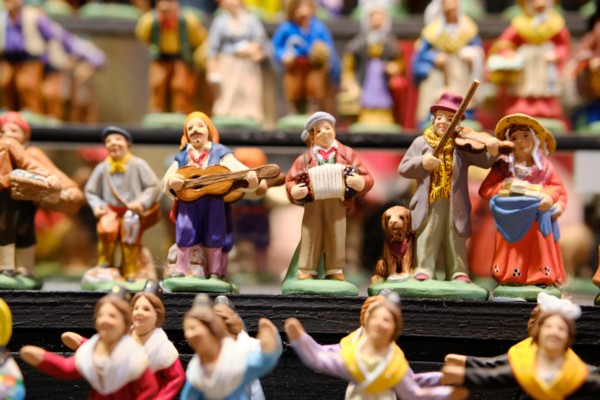 Large display of Santon figurines for sale in a market booth  at the Strasbourg Christmas Market