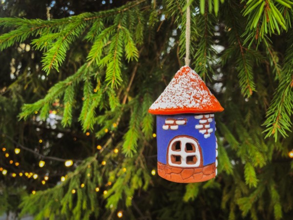 Ceramic Christmas decoration Old Tower on tree with lights. Tallinn Christmas Market