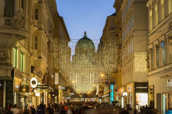 VIENNA, AUSTRIA - 2ND DECEMBER 2016: A view along Kohlmarkt in Vienna at Christmas. Lots of people, decorations and the outside of shops can be seen.