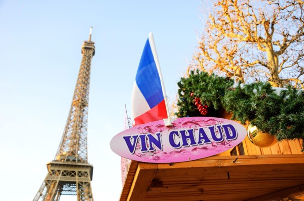PARIS, FRANCE - DECEMBER 26, 2015: Hot mulled wine ("vin chaud" in French) for sale Christmas market near Eiffel tower.