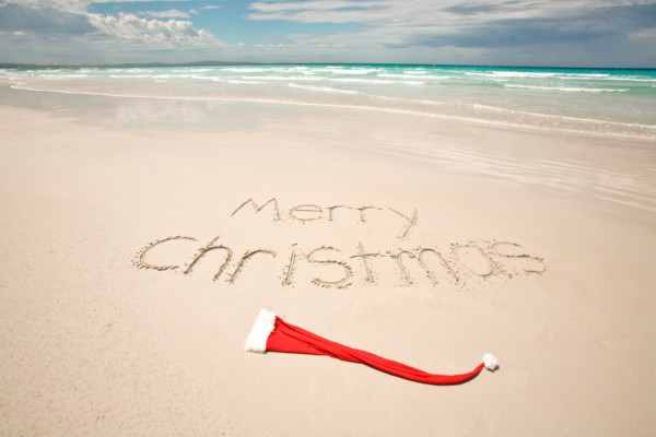 Merry Christmas written on a tropical beach