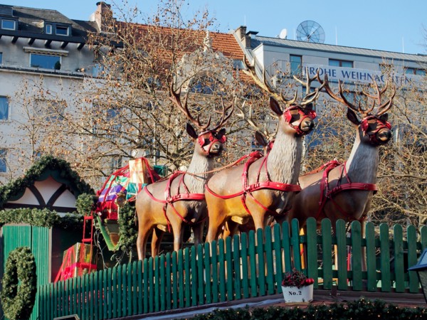 The reindeer and sleigh are ready in the Christmas market  (Weihnachtsmarkt) in the Rudolfplatz, Cologne, Germany, December 2014