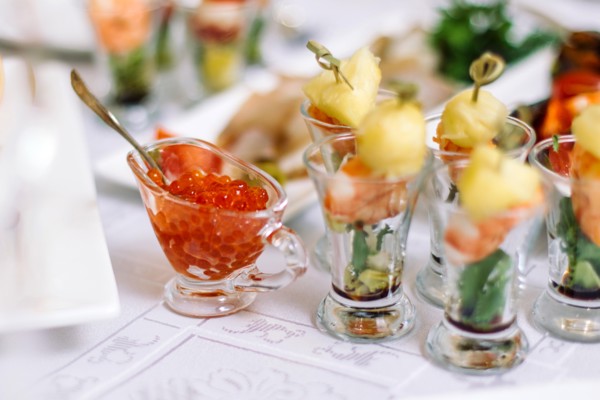 red caviar in a decorative plate on the christmas table.