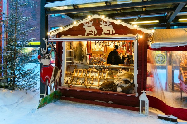 Rovaniemi, Finland - March 1, 2017: Street Market stall with traditional souvenirs in winter Rovaniemi, Lapland, in Finland.