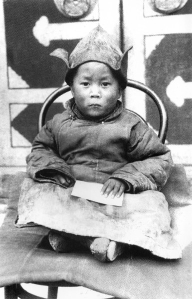 China/Tibet: The 14th Dalai Lama, Tenzin Gyatso (6 July 1935- ) as a child in Amdo shortly after being identified as the reincarnation of the 13th Dalai Lama, 1940s.  The 14th Dalai Lama (Religious na...