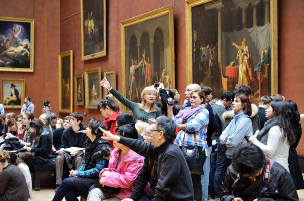 People viewing paintings, Musee du Louvre in Paris, France - Jan 2012