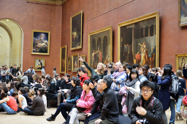 People viewing paintings, Musee du Louvre in Paris, France - Jan 2012