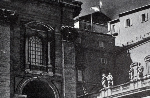 Black and white photograph of white smoke coming out of the chimney indicating that a new pope had been elected.