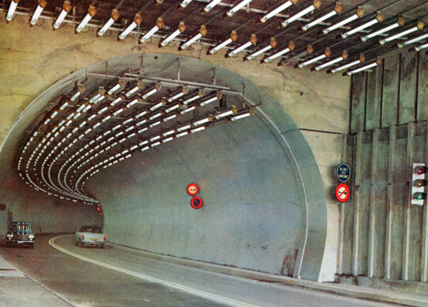 A postcard image of the Mont Blanc tunnel which runs 11.8km between France and Italy. At the time of opening in July 1965 it was three times longer than any rival tunnel. Original publisher: Couleurs ...