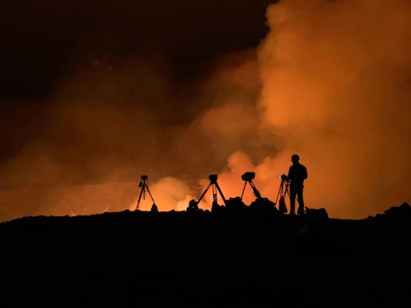 An Hawaiian Volcano Observatory geologist monitoring K?lauea ?volcano is erupting. Hawaii, USA. With the summit eruption continuing through the night, HVO scientists monitor the eruption for changes i...