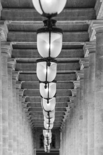Portrait photo of The Arcade Ceiling and Lamps in The Palais Royale in the 1st Arrondissement, Paris.