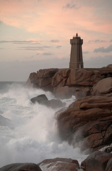 Lighthouse at Ploumanach on the Rose Granite coast Brittany France at Sunset