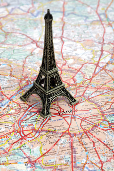 Statue of Eiffel Tower on map of Paris