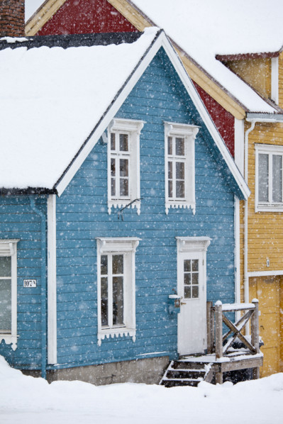 Quaint traditional architecture wooden buildings along Storgata in city of Tromso, in the Arctic Circle in Northern Norway