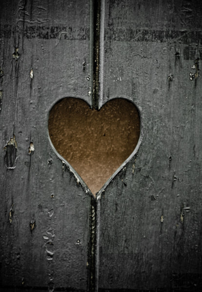 Wooden symbol - the heart cut out in boards