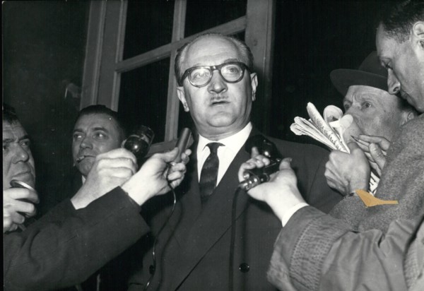 May 05, 1958 - Guy Mollet, who talked with Pierre Pflimlin, announced that he will accept the position of Council Vice-President. He is pictured making his announcement to the press. Germany - Policem...