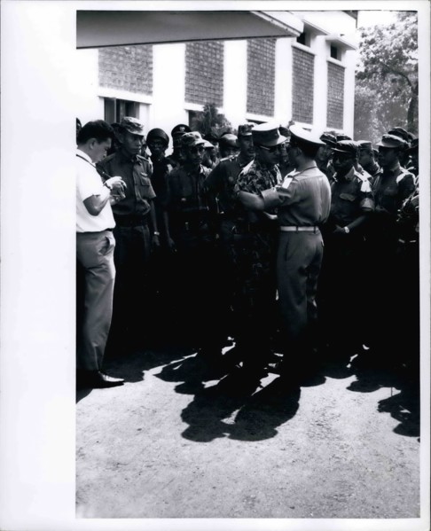 Feb. 28, 2012 - Grief stricken - Maj. General Suharto, newly appointed Army Chief of Staff in Indonesia, (in jungle suit) greets another officer at funeral services at Army Headquarters in Djakarta on...