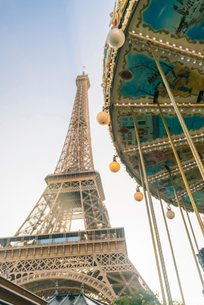 View of the famous Eiffel Tower and carousel in the foreground, Paris, France