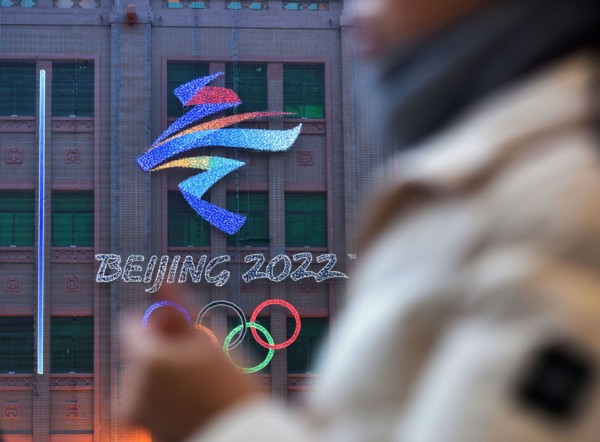 Beijing, China. 10th Feb, 2022. View of the emblem of the 24th Winter Olympic Games and the Olympic rings hanged on the wall of Beijing department store in the background. The 24th Winter Olympic Game...