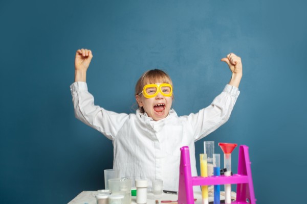 Science girl power. Happy child girl and science experiment. Brainstorm, idea and science concept.