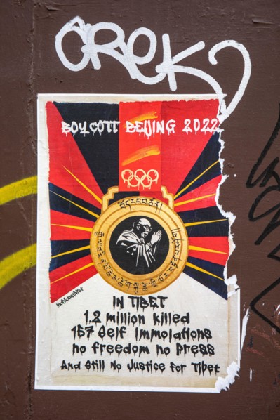 Torn poster calling for boycott of Beijing Olympic Games 2022 in Greenwich Village of New York City, United States of America