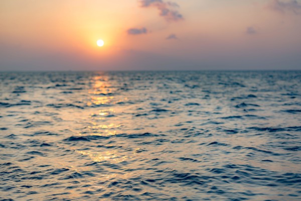 Sea on beautiful sunset, seascape. Vivid twilight sunset sky and motion blur of the sea under with long exposure effect.