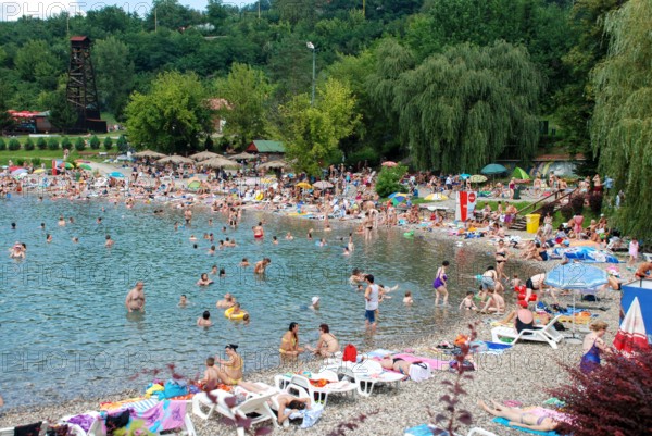 Tuzla, Bosnia and Herzegovina: Pannonian Lakes Complex. Overcrowded open swimming pools during peak of tourist season. Panonska jezera.
