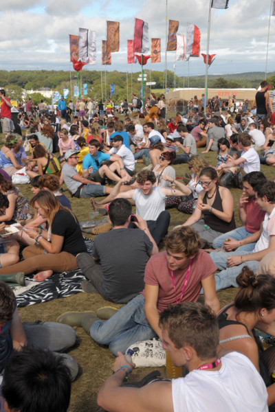 Crowds of music fans at the 2011 Bestival music festival pop concert on the Isle of Wight, England.