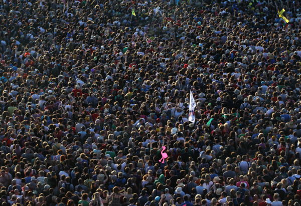 Festival-goers crowd around a stage to watch Pulp perform at The Glastonbury Festival in England 2011