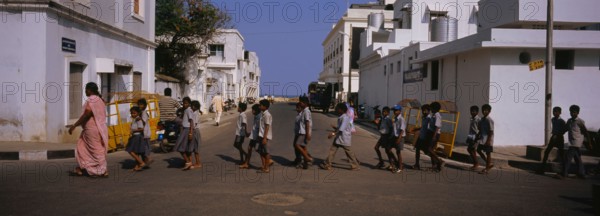 School children crossing the road, Pondicherry, India