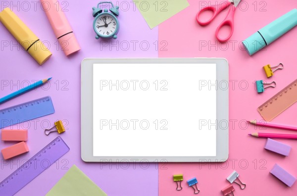 Digital tablet mock up template screen on school stationery pastel background.