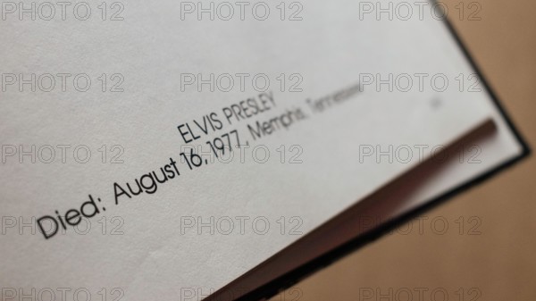 Close-up of 'Elvis Presley' text, showing date and place of death.