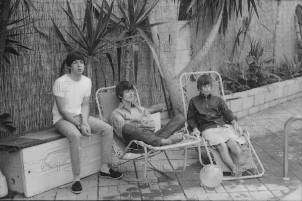 Beatles files 1964 The Beatles relaxing in sun loungers by their swimming pool in Bel Air in California during their first American tour August 1964