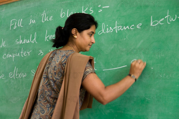 Teacher at a school in Hazira, near Surat. Gujarat. India