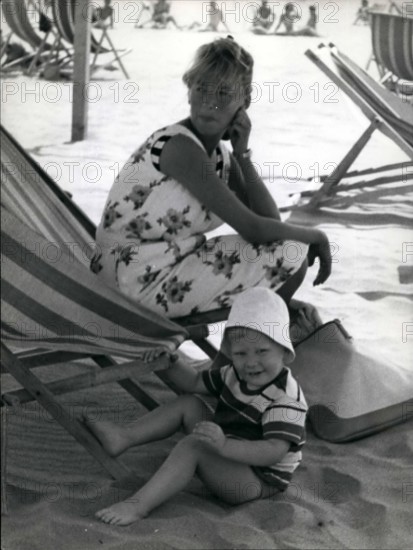 1968 - Paola di Liegi and her family at the beach of Marina di Massa, where they will stay for two months. The little Phillipe enjoys himself on the beach, while his sister Princess Astrid, sleeps on ...