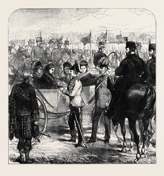 REVIEW AT WINDSOR: THE QUEEN PRESENTING THE CROSS OF ST. MICHAEL AND ST. GEORGE TO SIR GARNET