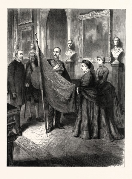 A TROPHY FROM THE SOUDAN (SUDAN): LIEUTENANT WILFORD LLOYD PRESENTING ONE OF THE MAHDI'S FLAGS TO