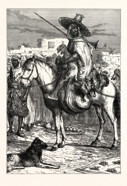 AN ARAB MERCHANT AT TLEMCEN, ALGERIA