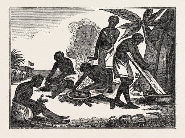 NATIVES OF MADAGASCAR PREPARING BREAD FROM THE MANIOC ROOT