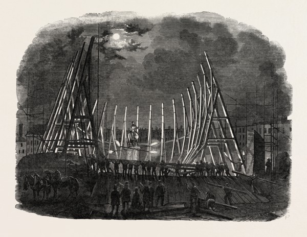RAISING THE TRUSSES OF THE BUILDING IN LEICESTER SQUARE, LONDON, UK, FOR MR. WYLD'S LARGE MODEL OF