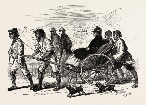 A DRAG ACROSS THE SAND IN A JINRIKISHA, RICKSHA, PULLED RICKSHAW. A TWO-WHEELED CART WHICH SEATS