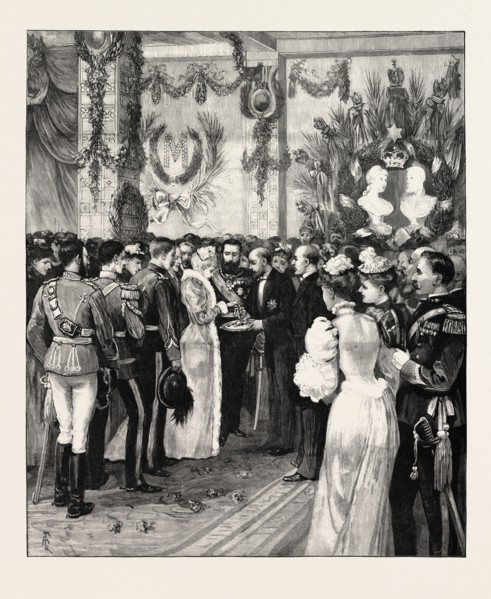 THE ROYAL HOME-COMING AT BUCHAREST: THE MAYOR OFFERING BREAD AND SALT AT THE RAILWAY STATION,