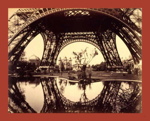 Exhibit buildings and grounds seen through the lower part of the Eiffel Tower, Paris Exposition,