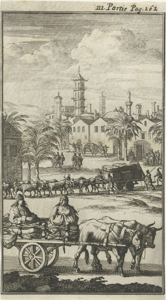 Oxen pulling carts laden with goods and people, in the background an Indian city can be seen, Jan