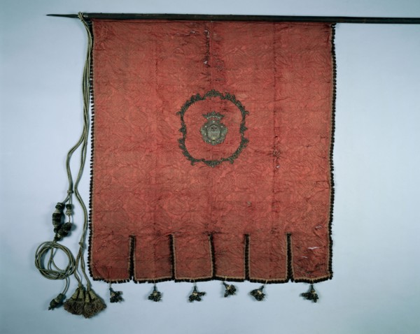 Banner, 1700s. Spain, 18th century. Crimson silk brocade, with applied embroidery; scalloped border