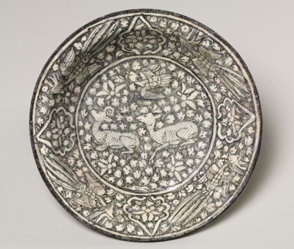 Ceramic dish with deer, phoenix, and lotus blossoms, 1300-1350. Iran, Sultanabad. Fritware with