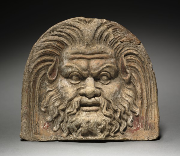 Antefix with Satyr Face, 370-330 BC. Italy, mid-4th Century BC. Terracotta; overall: 17.1 cm (6 3/4