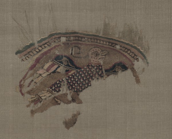 Fragmentary roundel with eagle in gold ground, 1000s. Egypt, Fatimid period. Plain weave with